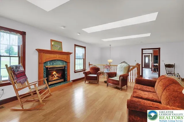 a view of a livingroom with furniture and a window