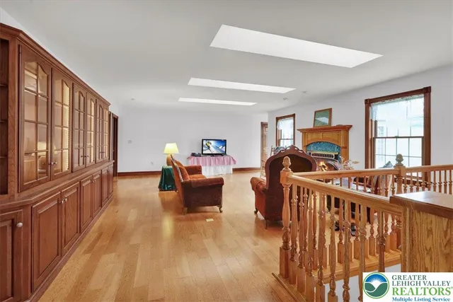 a view of a livingroom with furniture and a flat screen tv