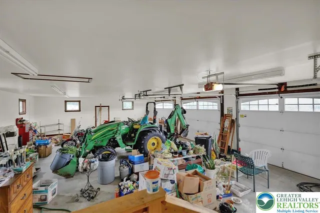 an aerial view of a house with a big yard
