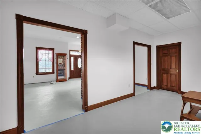 a aerial view of a house with a yard table and chairs