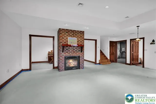 a aerial view of a house with a yard table and chairs