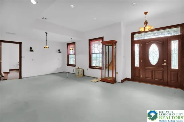 an aerial view of a house with a garden and swimming pool