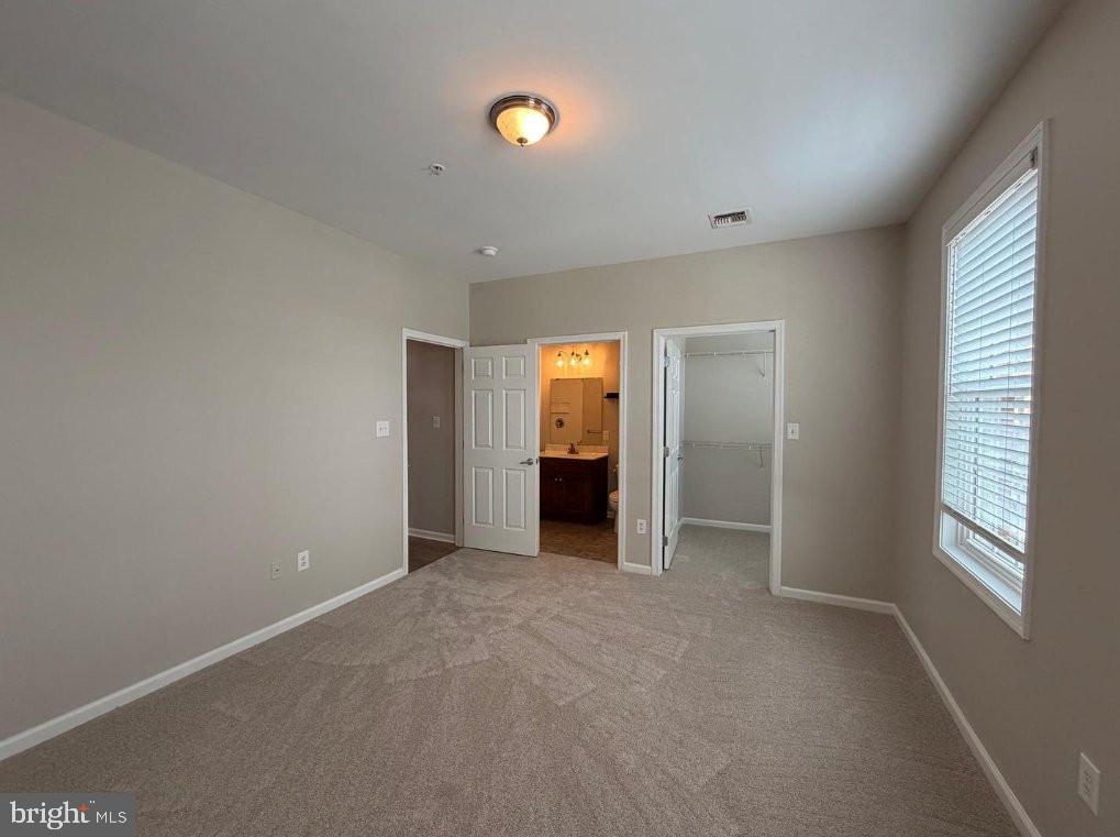 134 Bridge Street, Unit 201 Phoenixville, PA 19460 - Photo 11 of 12 a view of an empty room with a window and bathroom