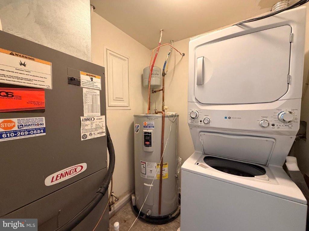 134 Bridge Street, Unit 201 Phoenixville, PA 19460 - Photo 8 of 12 a utility room with dryer and washer