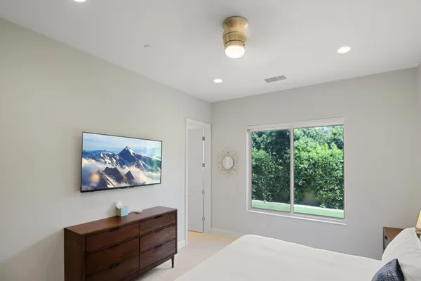 a view of a livingroom with wooden floor and window