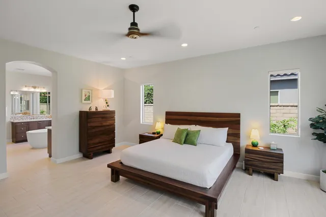 a bedroom with bed and window