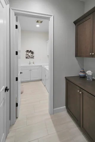 a bathroom with a bathtub sink and mirror