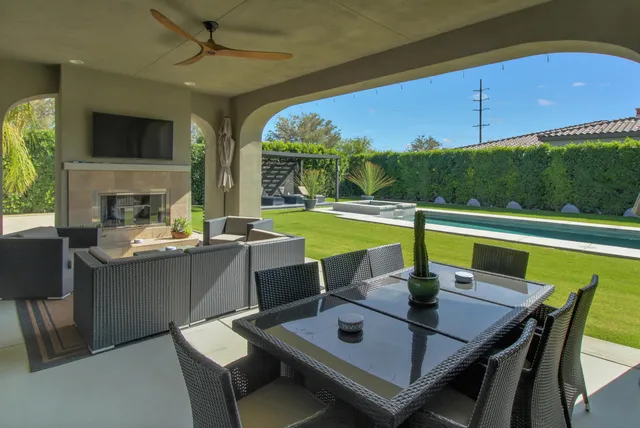 a view of a dining room with furniture window and outside view