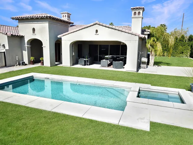 a view of swimming pool with a yard