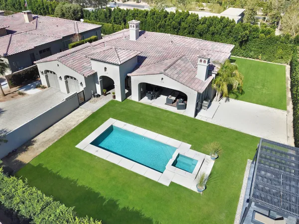 a aerial view of a house with a big yard