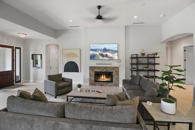 a living room with furniture and a fireplace