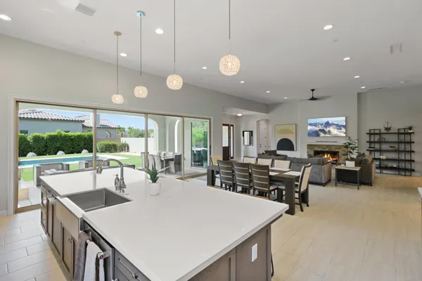 a large kitchen with a table and chairs