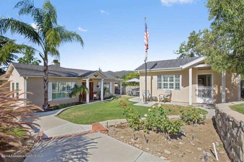 2340 Caldero Lane Montrose, CA 91020 - Photo 2 of 10 a front view of a house with a garden and patio