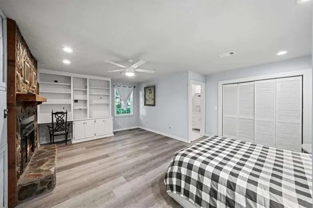 a bedroom with a large bed and a walk in closet