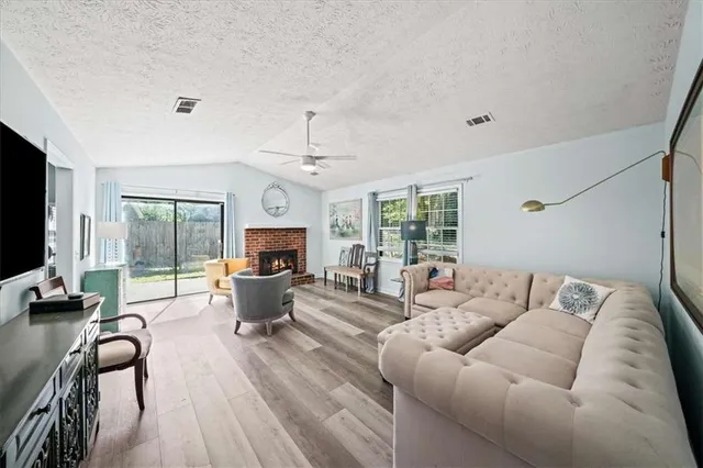 a living room with furniture or couch and a flat screen tv