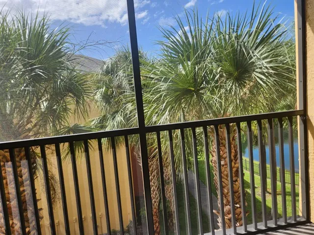 a view of balcony with wooden floor