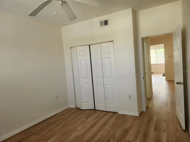 an empty room with wooden floor