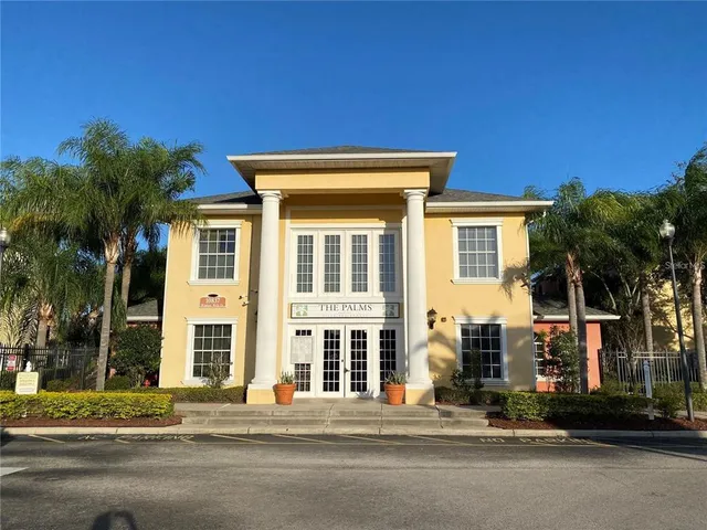 a front view of a house with a road