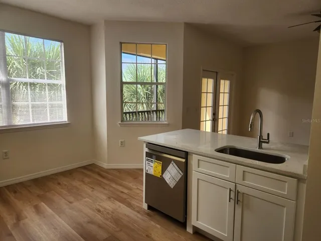 a kitchen with a stove and a sink