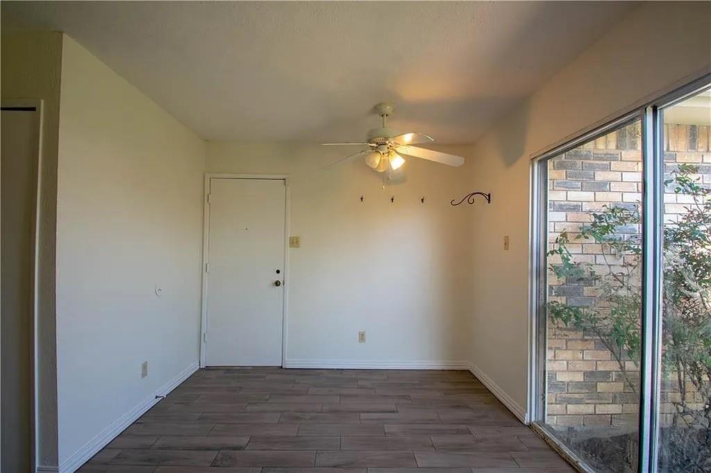 6500 Blue Ridge Trail Plano, TX 75023 - Photo 6 of 14 Interior space featuring wood-finish flooring, a ceiling fan with light fixture, and a full-light window