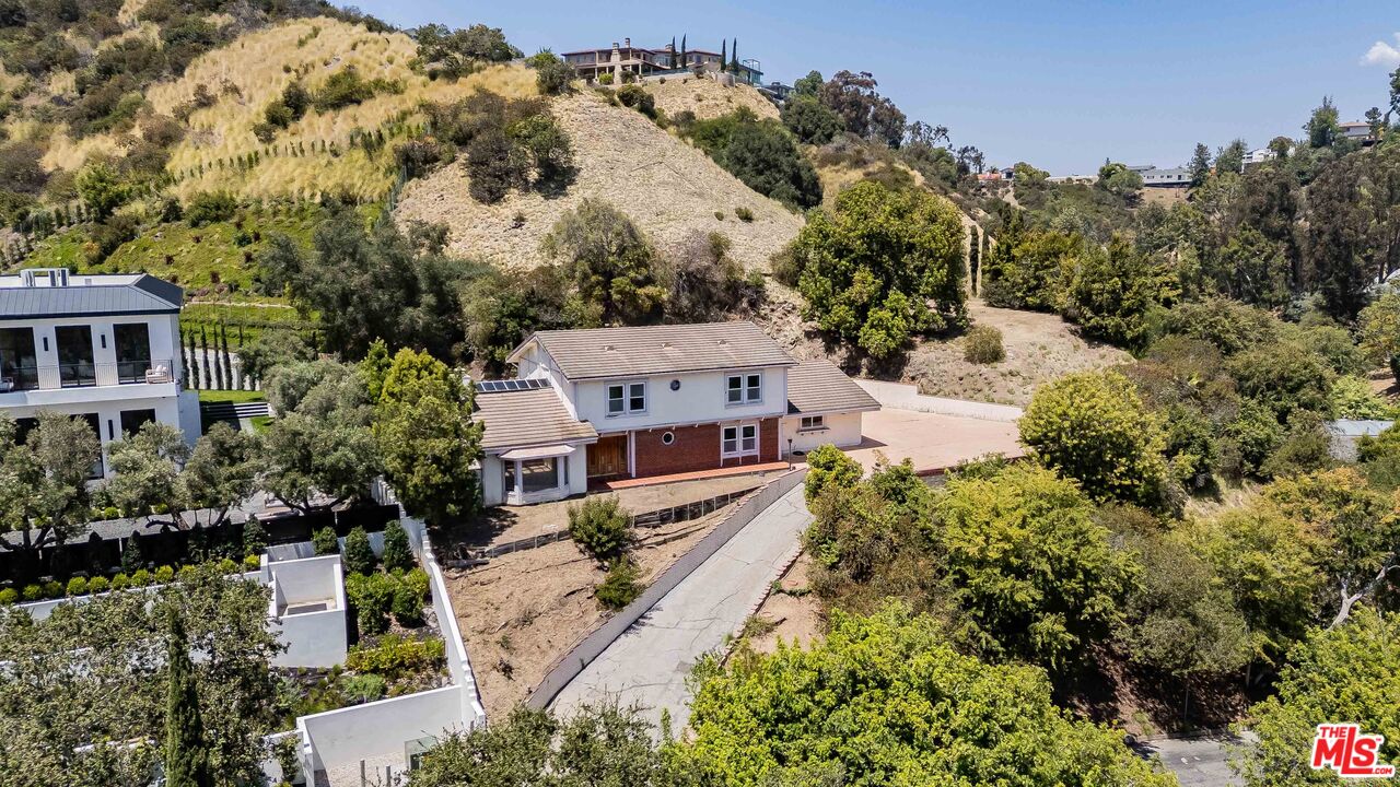 1181 Somera Road Los Angeles, CA 90077 - Photo 2 of 40 an aerial view of a house with a yard basket ball court and outdoor seating