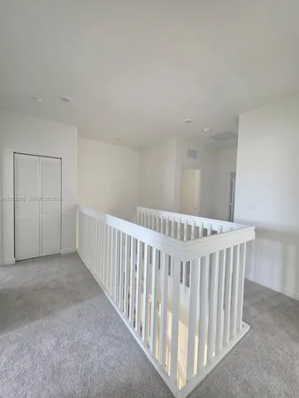 a view of a balcony with wooden floor