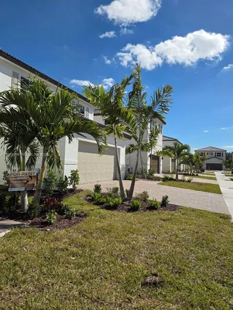 a view of a yard and front view of a house