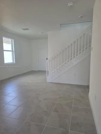 a kitchen with a sink and a window