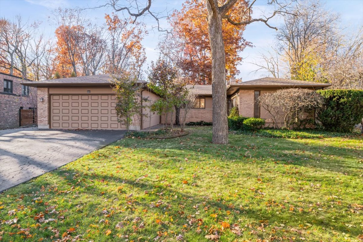 3296 Brook Road Highland Park, IL 60035 - Photo 1 of 21 a view of a house with a yard and garage