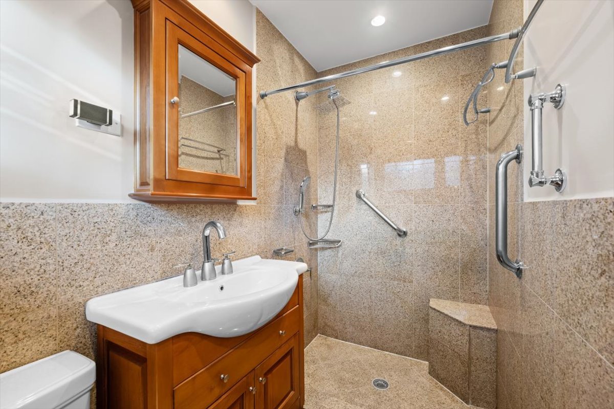 3296 Brook Road Highland Park, IL 60035 - Photo 13 of 21 a bathroom with a sink toilet and shower