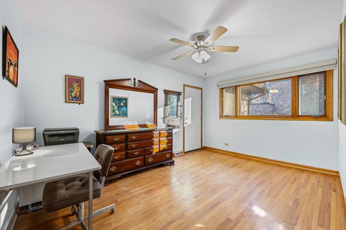 3296 Brook Road Highland Park, IL 60035 - Photo 14 of 21 a living room with furniture and paintings on the wall