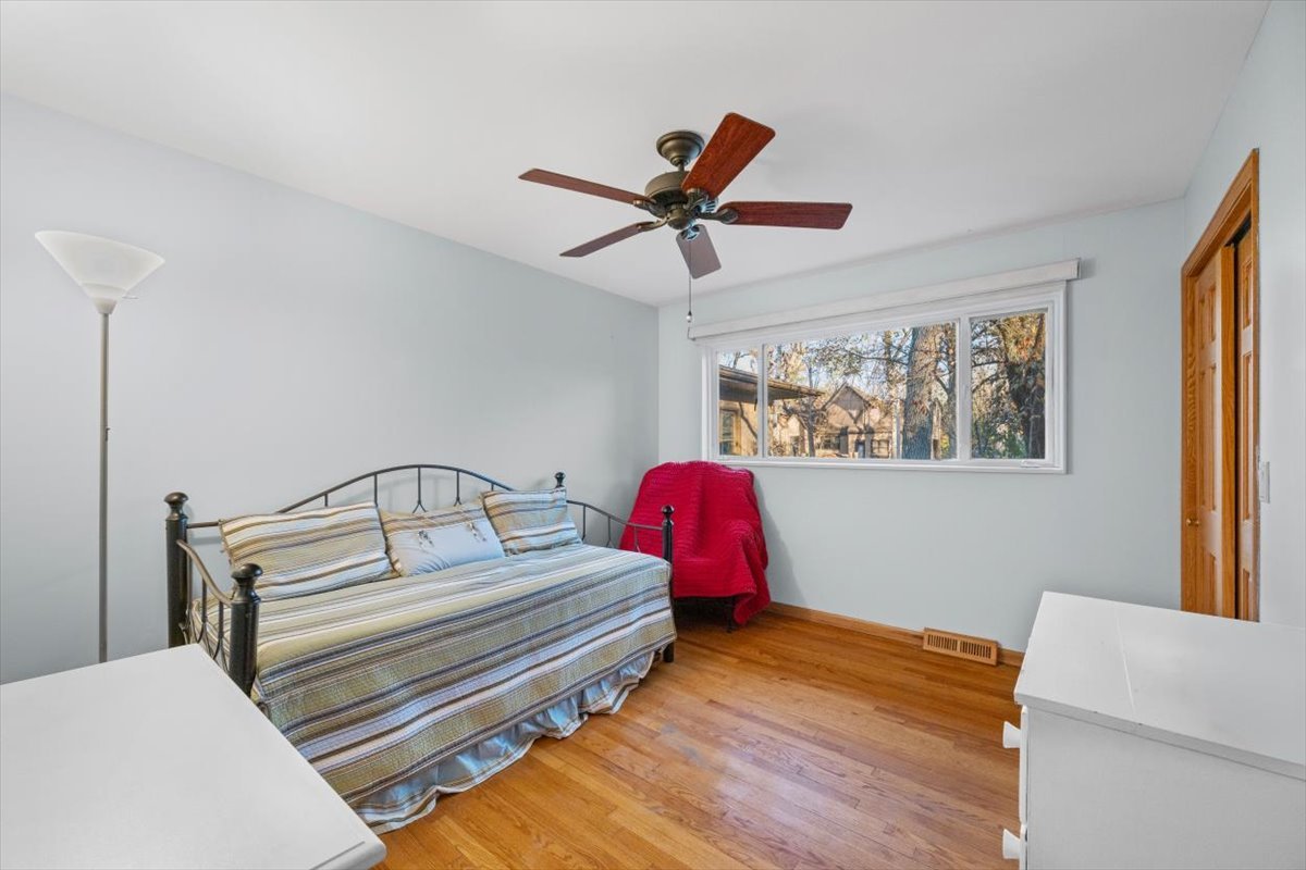 3296 Brook Road Highland Park, IL 60035 - Photo 15 of 21 a bedroom with a bed and a chandelier