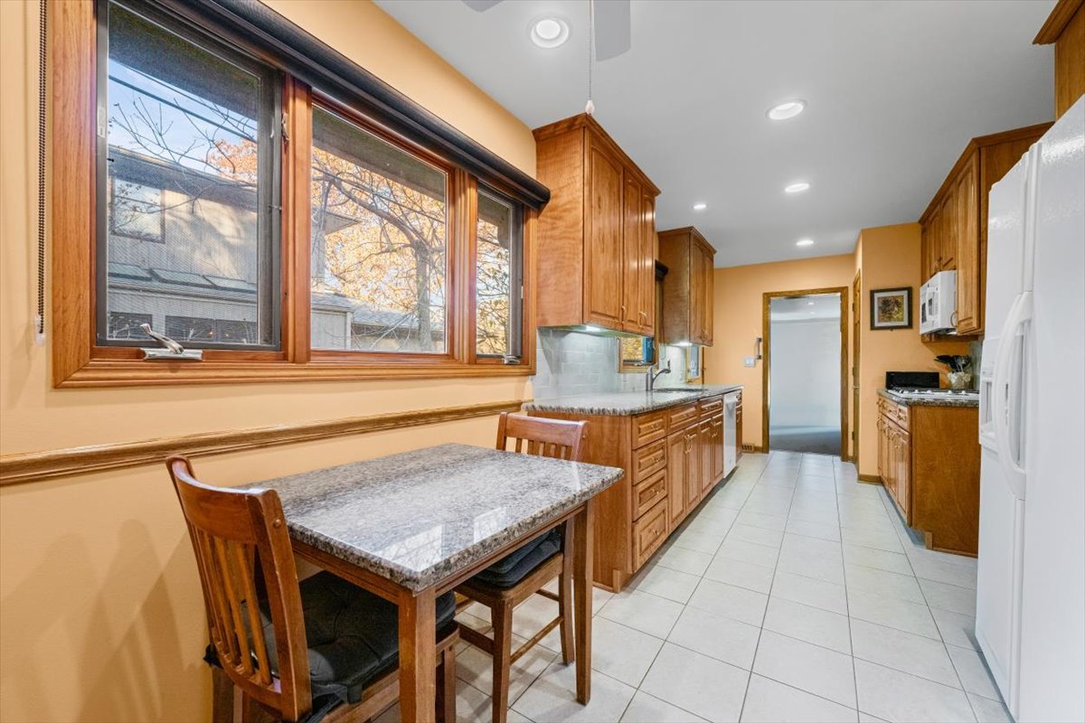 3296 Brook Road Highland Park, IL 60035 - Photo 7 of 21 a kitchen with a table and chairs