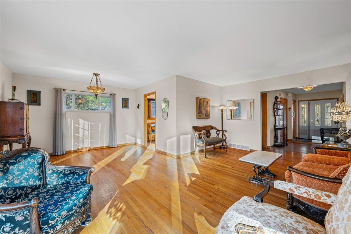 3296 Brook Road Highland Park, IL 60035 - Photo 8 of 21 a bedroom with furniture and a wooden floor