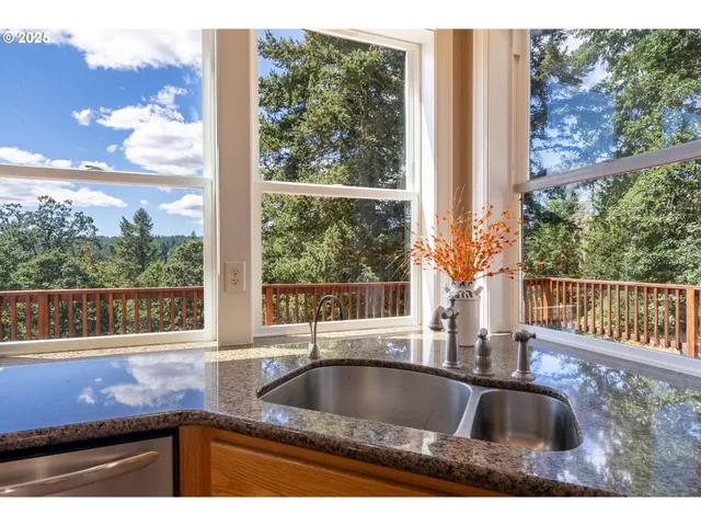 a kitchen with granite countertop a sink and a window