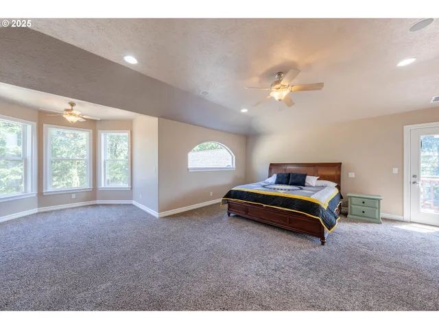 a bedroom with furniture and window