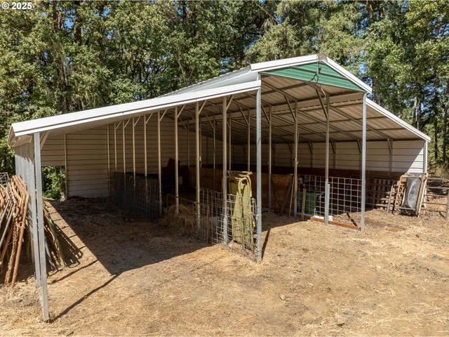 a view of a house with a yard and potted plants