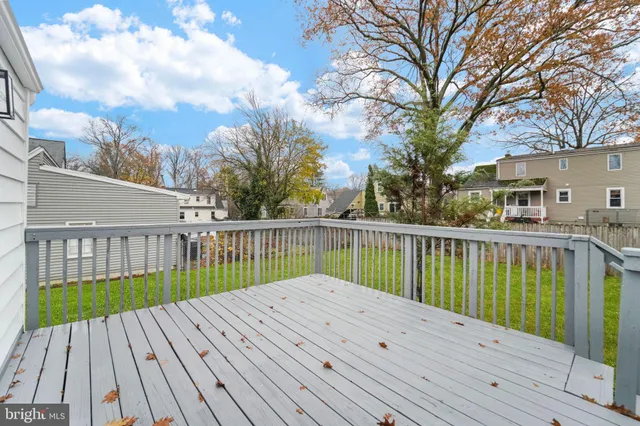 a view of balcony with wooden floor and fence