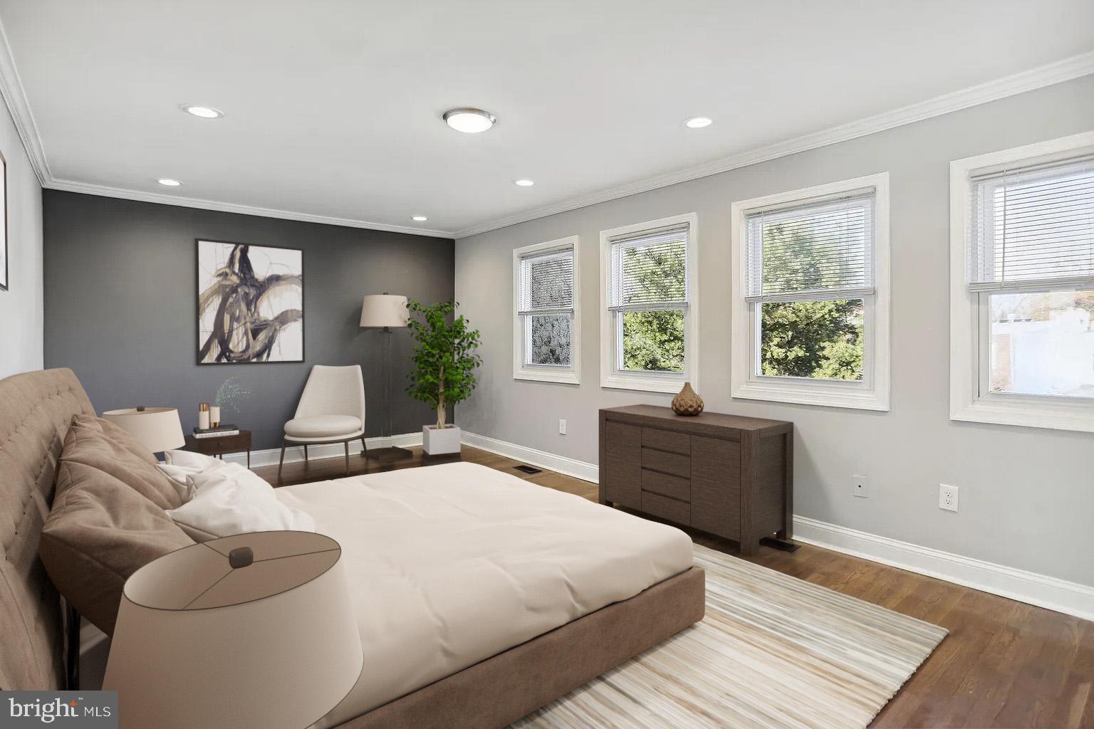 1507 Freedom Way Southeast, Unit 2 Washington, DC 20003 - Photo 11 of 22 a spacious bedroom with a bed and wooden floor