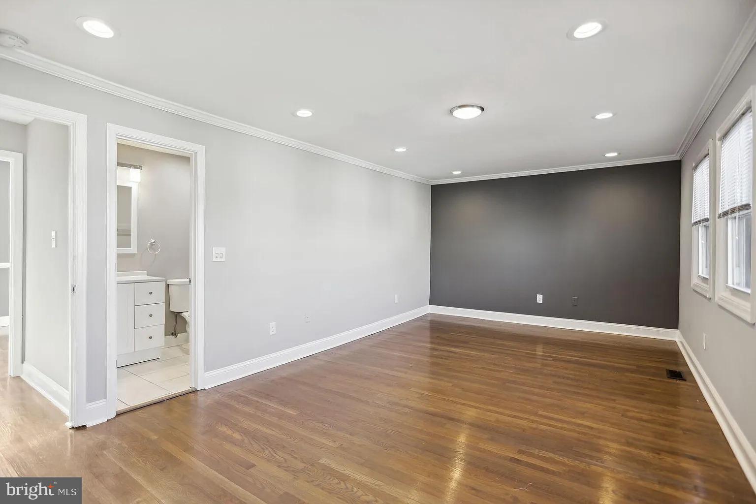 1507 Freedom Way Southeast, Unit 2 Washington, DC 20003 - Photo 14 of 22 a view of an empty room with wooden floor