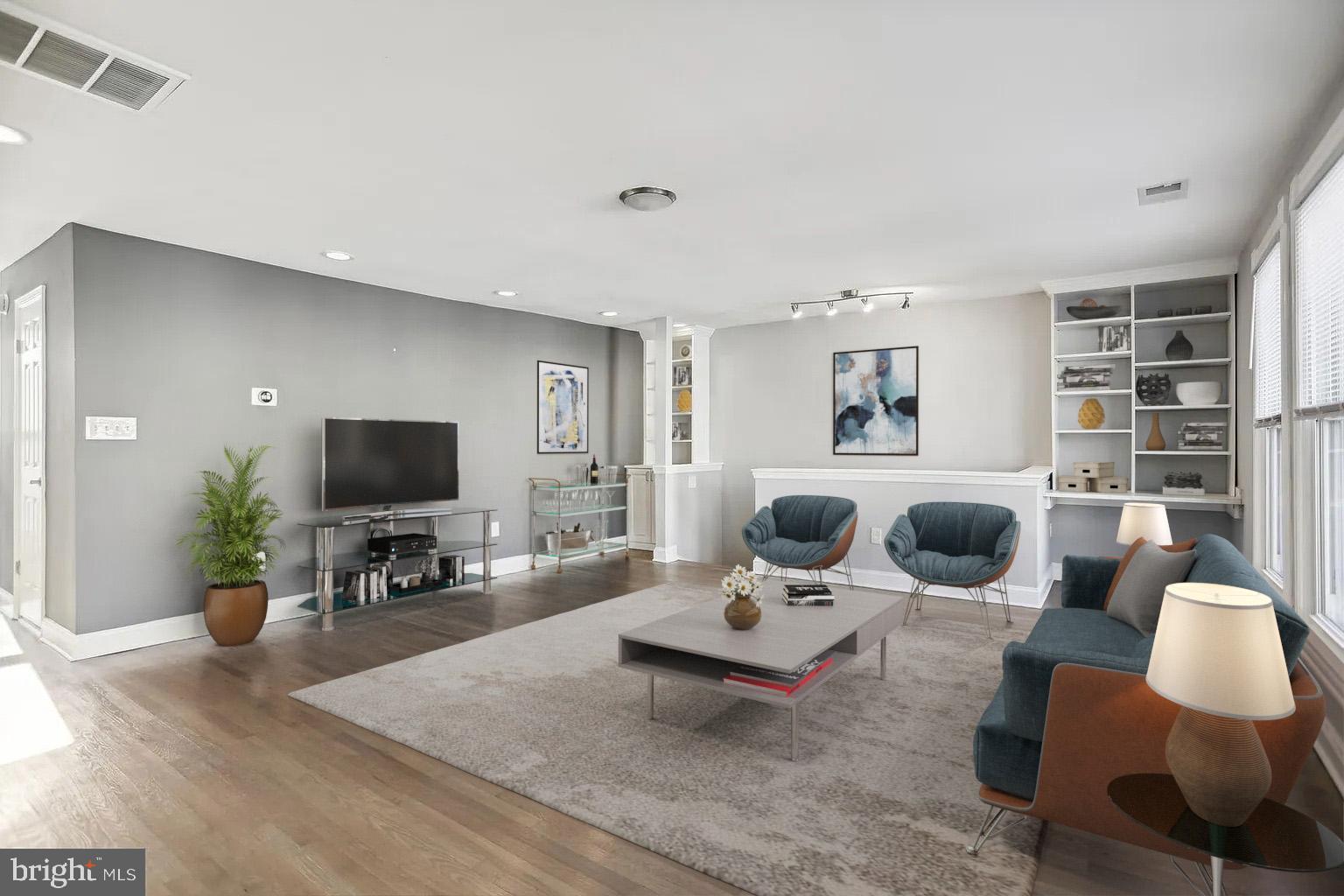1507 Freedom Way Southeast, Unit 2 Washington, DC 20003 - Photo 2 of 22 a living room with furniture a rug and a flat screen tv