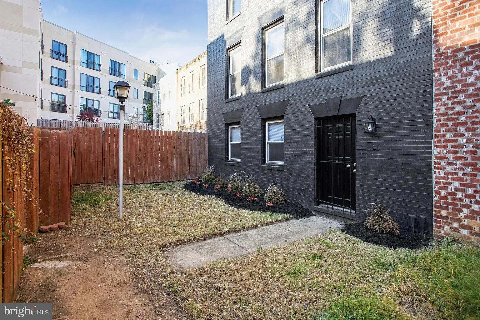 1507 Freedom Way Southeast, Unit 2 Washington, DC 20003 - Photo 22 of 22 a house with trees in front of it