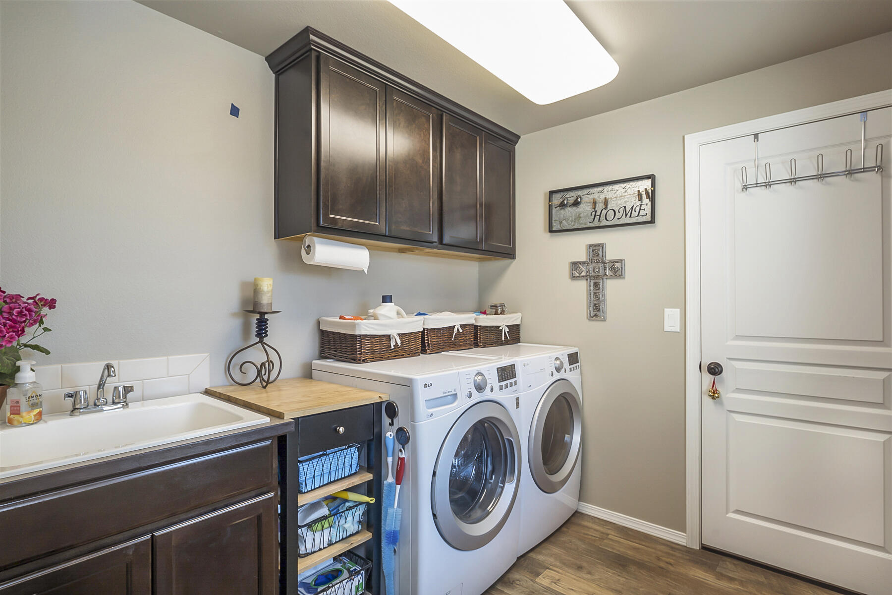 67140 Harrington Loop Road Bend, OR 97703 - Photo 16 of 37 Large laundry room with sink and storage