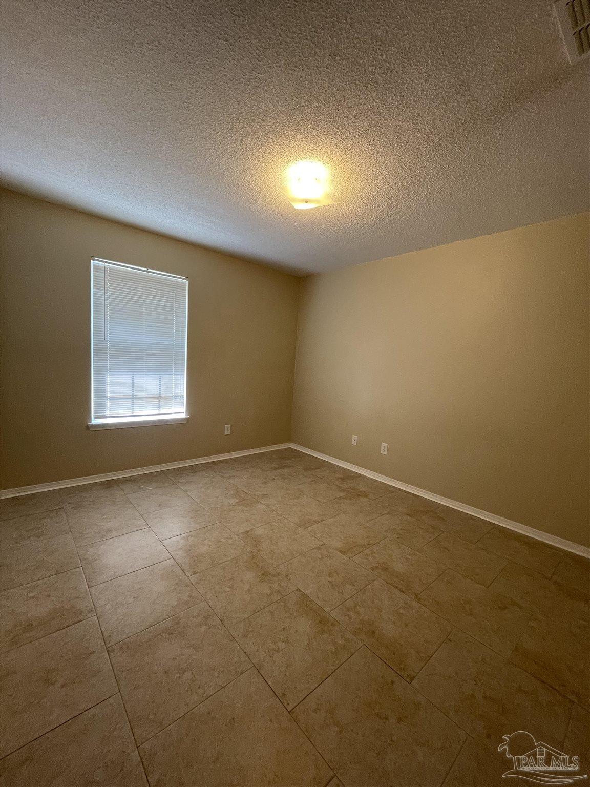 6208 St Ann Avenue Milton, FL 32570 - Photo 11 of 20 an empty room with a empty space and windows