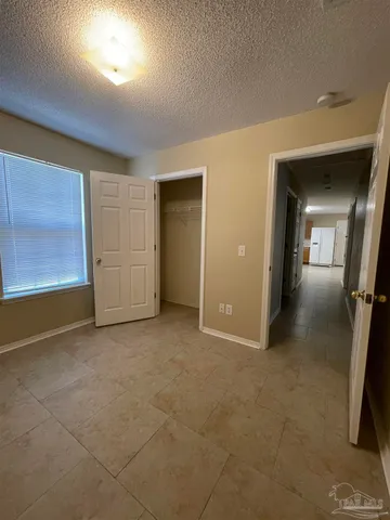 wooden floor in a room with a bathroom