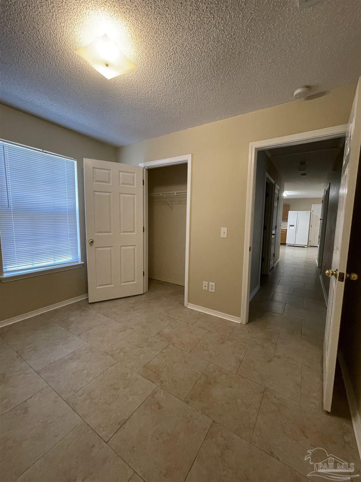 6208 St Ann Avenue Milton, FL 32570 - Photo 14 of 20 wooden floor in a room with a bathroom
