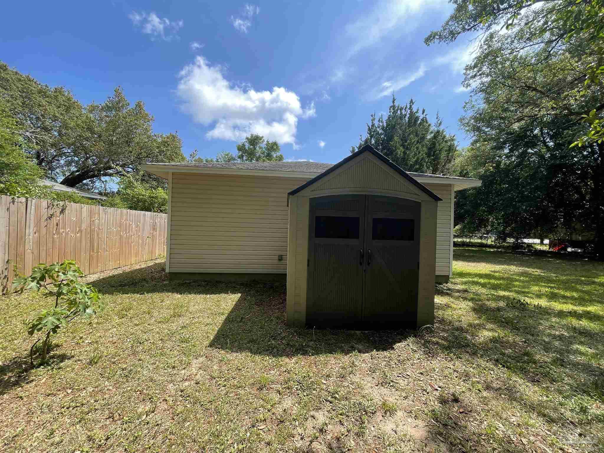 6208 St Ann Avenue Milton, FL 32570 - Photo 16 of 20 a front view of a house with a yard