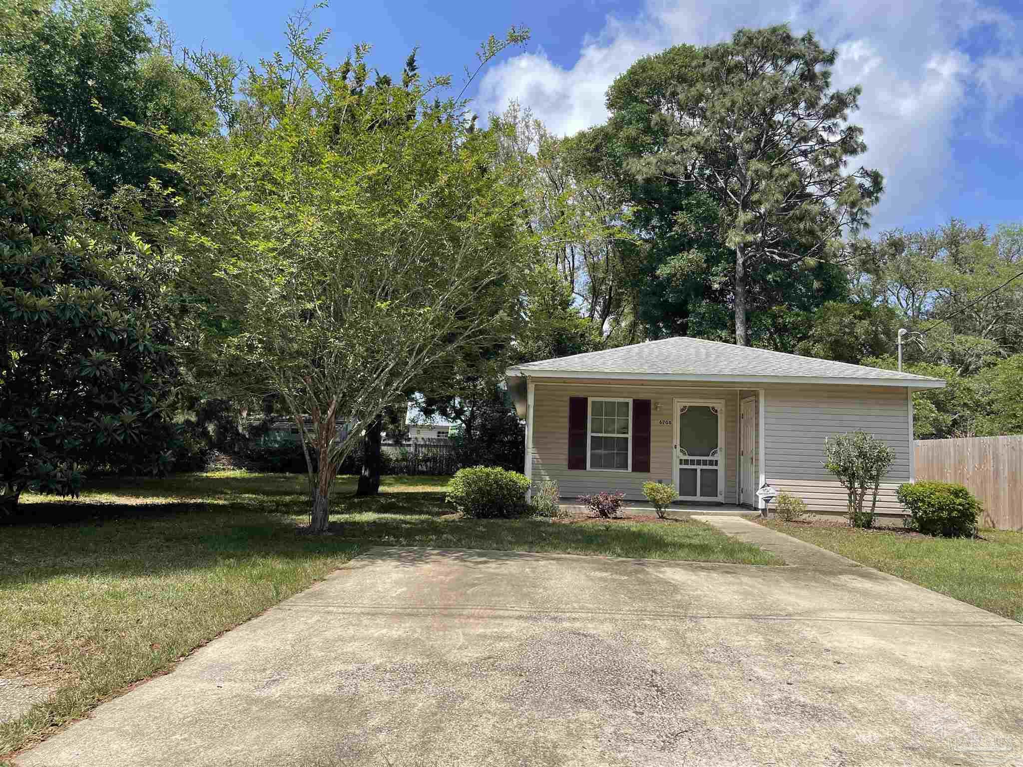 6208 St Ann Avenue Milton, FL 32570 - Photo 19 of 20 a front view of a house with a yard