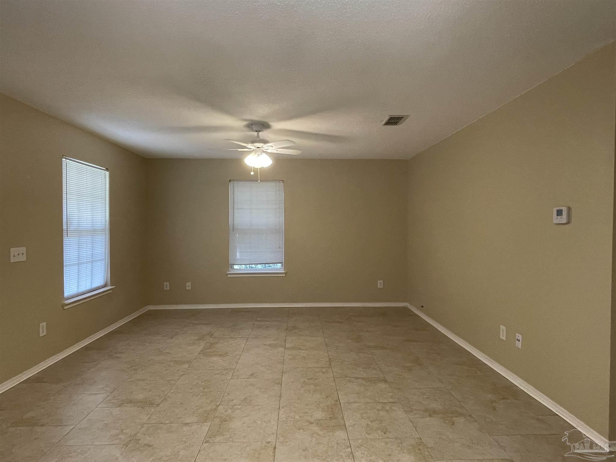 6208 St Ann Avenue Milton, FL 32570 - Photo 5 of 20 a view of an empty room with a window