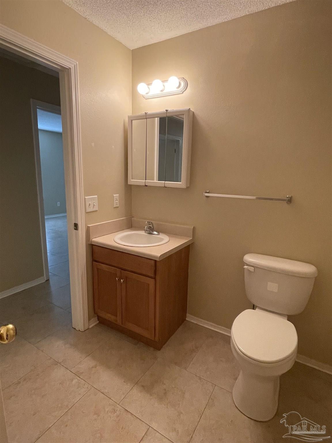 6208 St Ann Avenue Milton, FL 32570 - Photo 10 of 20 a bathroom with a toilet sink and mirror
